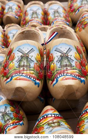 ALKMAAR - AUGUST 2015 : Typical dutch wooden clogs (klompen), painted with tulips and a windmill
