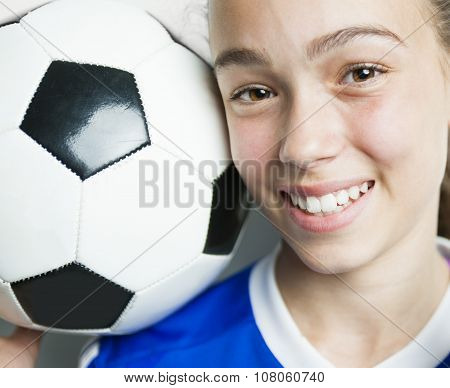 girl in sport wear with football isolated on white background