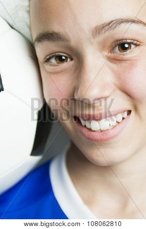 girl in sport wear with football isolated on white background