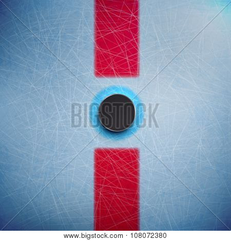 Hockey puck isolated on ice top view