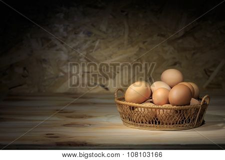 Still life eggs in the basket on loe key light.