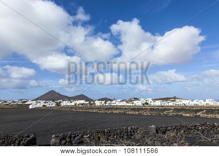 Village Of Tinajo With  Volcanoes Of Timanfaya National Park