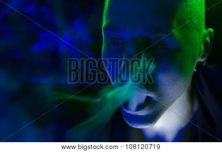 Club Party - Nightlife. Handsome Sexy Young Stylish Man Smoking In Nightclub