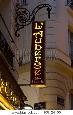 PARIS, FRANCE - SEPTEMBER 11, 2014: Latin Quarter. Narrow street of Paris among old traditional parisian houses and cafe in Paris. Famed for its nightlife Paris has about 40 000 restaurants