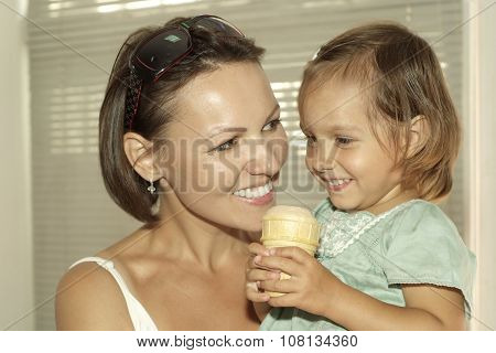 girl and mother eating ice cream