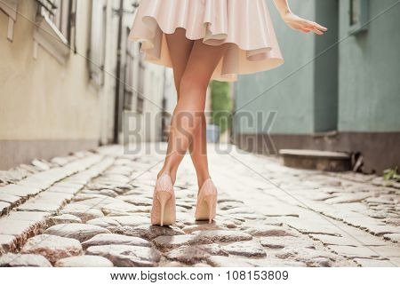 Elegant lady walking alone in the street