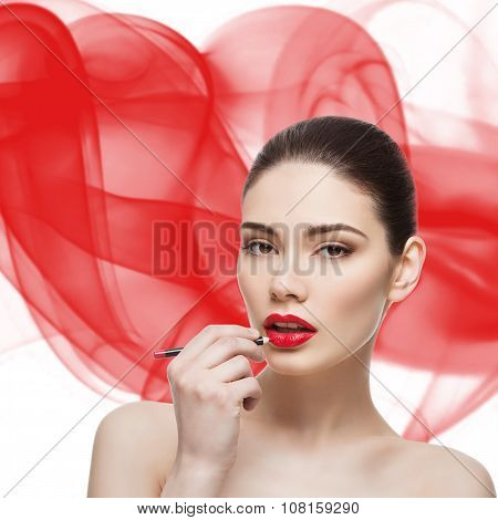 Beautiful girl with lip pencil