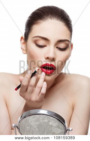 Beautiful girl with lip pencil