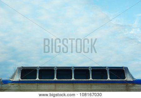passenger window train wagon on cloudy sky early morning
