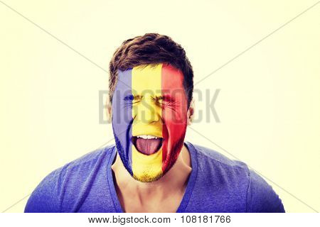 Screaming man with Andora flag painted on face.