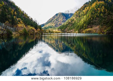 Scenery Of Lake in Forest with Colorful Leafs and Mountain in Autumn