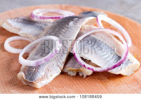 Pieces Of Herring Fillet On A Cutting Board