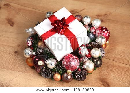 New Year gift on a golden tinsel background boly