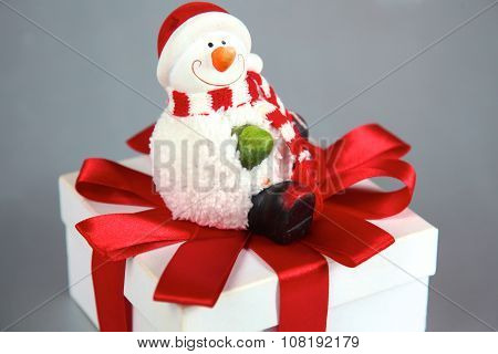 New Year gift on a golden tinsel background boly