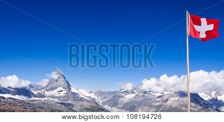 Matterhorn peak  in panorama with Switzerland flag, Switzerland