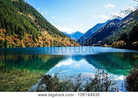 Scenery Of Lake in Forest with Colorful Leafs and Mountain in Autumn