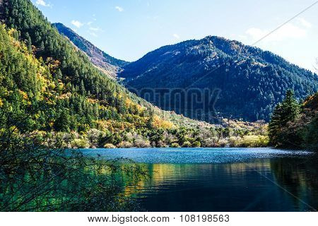 Scenery Of Lake in Forest with Colorful Leafs and Mountain in Autumn
