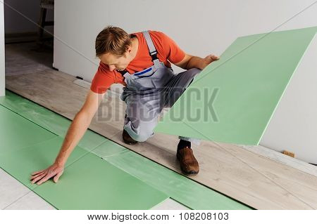Worker Puts The Pieces Underlaymen