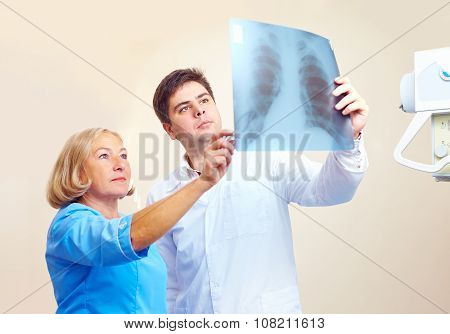 Medical Staff Discussing The Roentgen Radiogram In Hospital