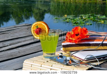 Cocktai With Fruits, Laptop, Cell Phone, Headphones And Bath Towels