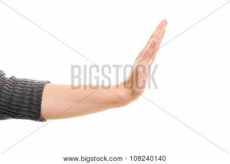 A close up shot of a hand gesturing stop, isolated on white background.
