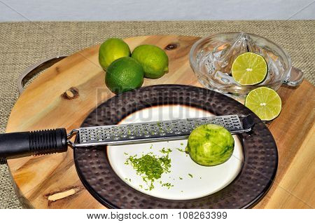 Limes with zest, zester and juicer