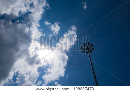 A Light Pole in Cloudy Sky
