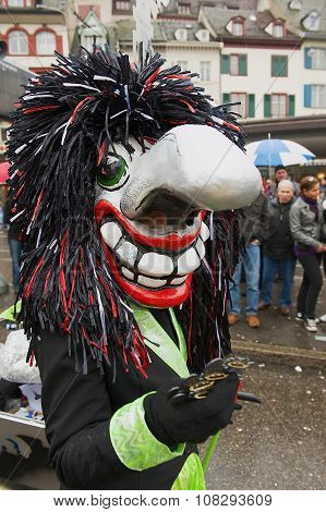 Person wears Waggis mask at Basel Carnival in Basel, Switzerland.