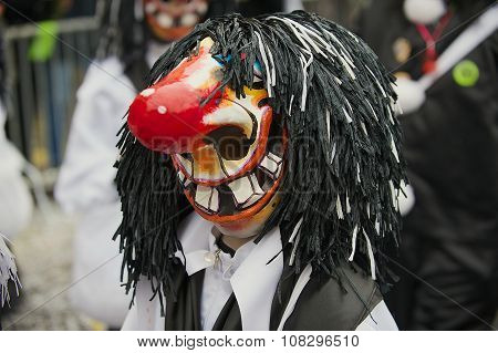 Person wears Waggis mask at Basel Carnival in Basel, Switzerland.