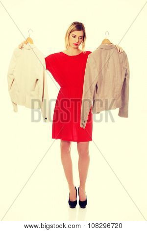 Beautiful woman thinking what to wear.