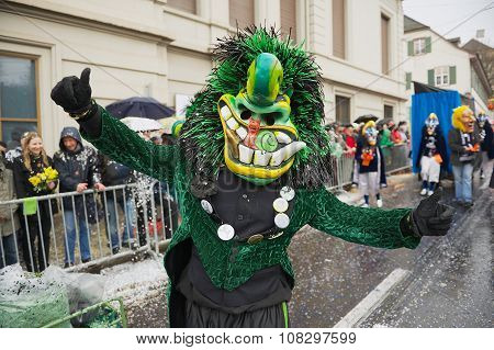 Person wears Waggis mask at Basel Carnival in Basel, Switzerland.