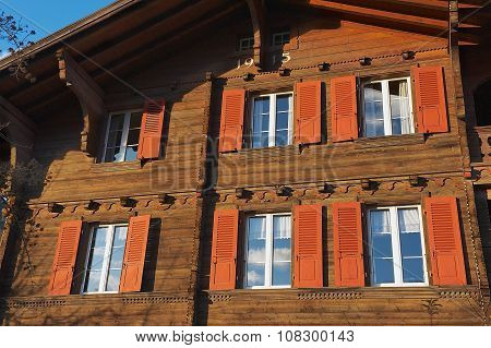 Exterior of a traditional Swiss wooden chalet in Brienz, Switzerland.