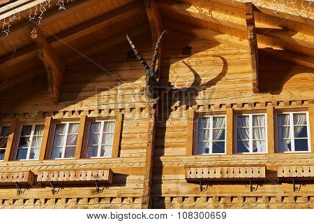 Exterior of a traditional Swiss wooden chalet in Brienz, Switzerland.