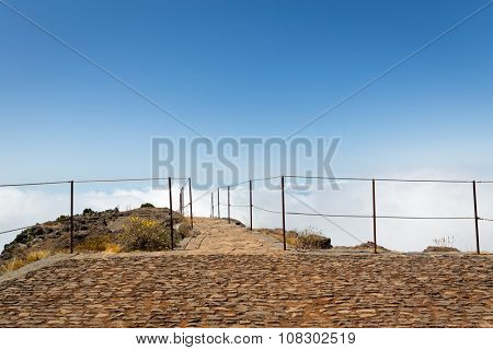 Observation platform with fence in mountains against sky, Portugal, Madeira