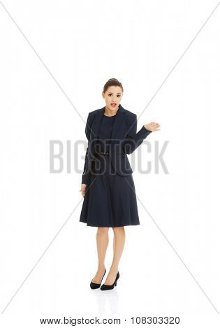 Anoyed and displeased businesswoman standing