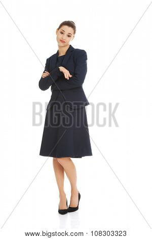 Anoyed and displeased businesswoman standing