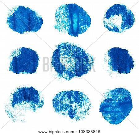 Blue ink round shapes isolated on white background.