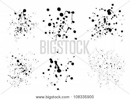 Black ink spray drops isolated on white background.