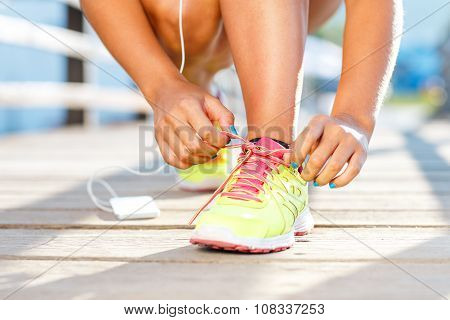 Running Shoes - Woman Tying Shoe Laces