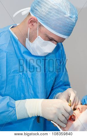 Dentists during surgery for implant placement
