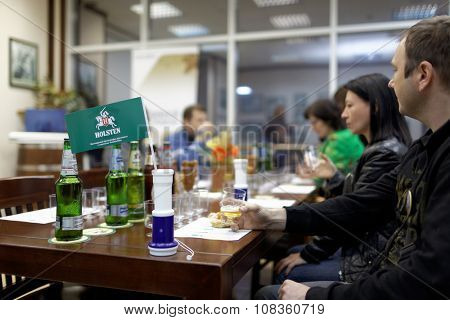 ST. PETERSBURG, RUSSIA - OCTOBER 24, 2015: Tourists during tasting session at the Baltika - St Petersburg brewery. This session is a part of the October Beer Festival celebrations