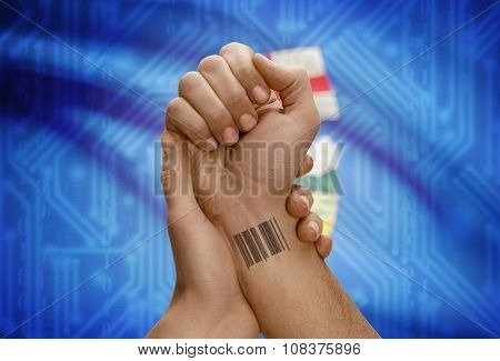 Barcode Id Number On Wrist Of Dark Skin Person And Canadian Province Flag On Background - Alberta