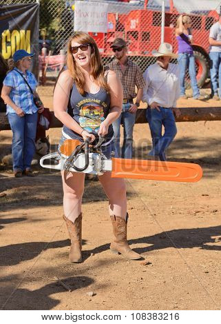 West Point, CA - October 4, 2014 Axe throwing & Chainsaw log cutting competitions at the Lumberjack Day Parade event