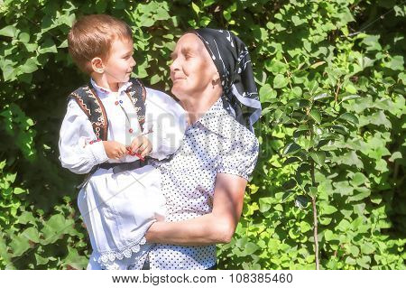 Great Grandmother Holding Her Grandson