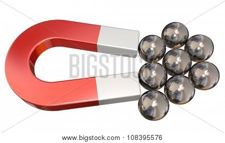 Reg metal magnet attracting several ball bearings to illustrate magnetic pull or force