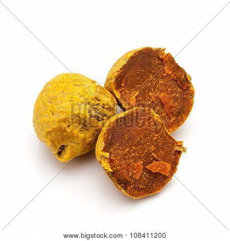 Macro closeup of a full and a cracked Organic Round Turmeric.