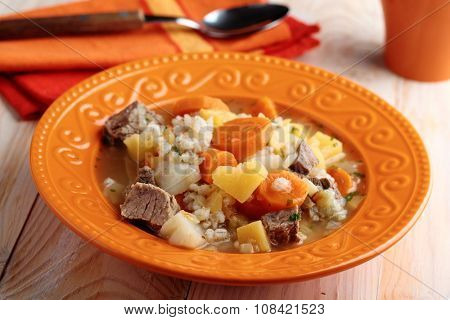 Irish coddle in a rustic bowl closeup