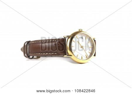 Gold watch on white background