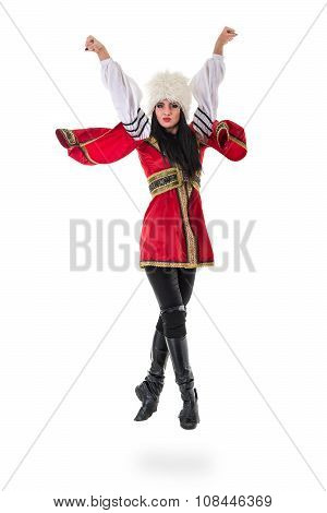 Young woman wearing a folk costumes jumping.  Isolated on white in full length with copyspace