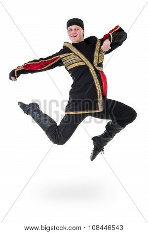 young man wearing a folk costume jumping against isolated white with copyspace